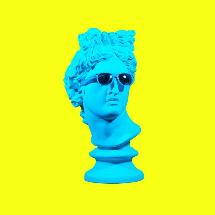 Poster Statue on a yellow background. Gypsum statue of David's head. Creative. Plaster statue of Apollo's head in blue sunglasses. Minimal concept art.