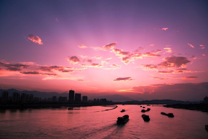 Poster Stedelijk landschap bij zonsondergang