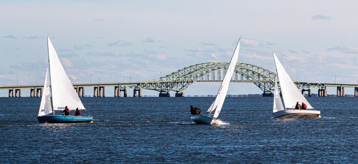 Poster Three two person sailboats in front of the Great South Bay bridge on a windy December afternoon