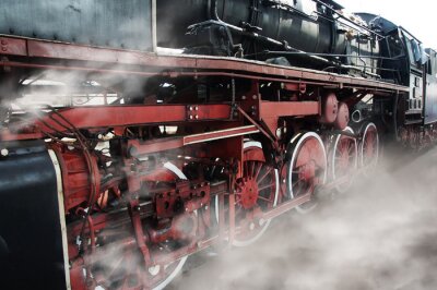 Trein locomotief in stoomwolken