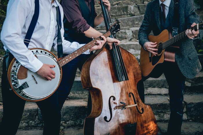 Poster Trio van muzikanten met een gitaar, banjo en contrabass
