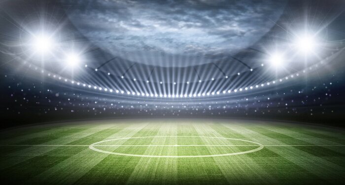 Poster Uitzicht op het veld en het stadion, verlicht door schijnwerpers.