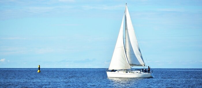 Poster Yacht sailing in calm water in the gulf of Riga