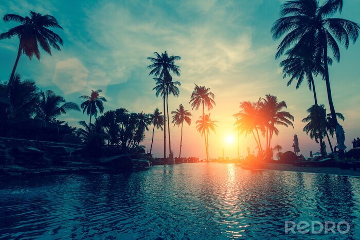 Poster Zonsondergang boven een zwembad
