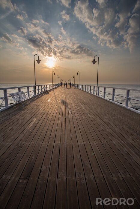 Poster Zonsondergang op de pier in Gdynia