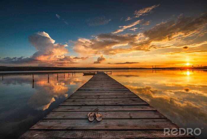 Poster Zonsondergang over het meer met een houten pier