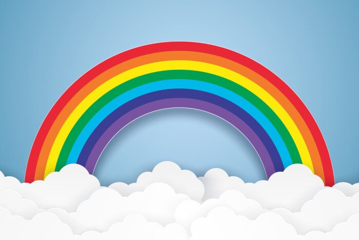 Sticker Blauwe lucht met een regenboog en wolken