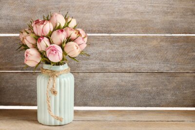 Bouquet of pink roses in turquoise ceramic vase