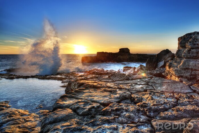 Sticker De aard van de golven die de rotsen raken