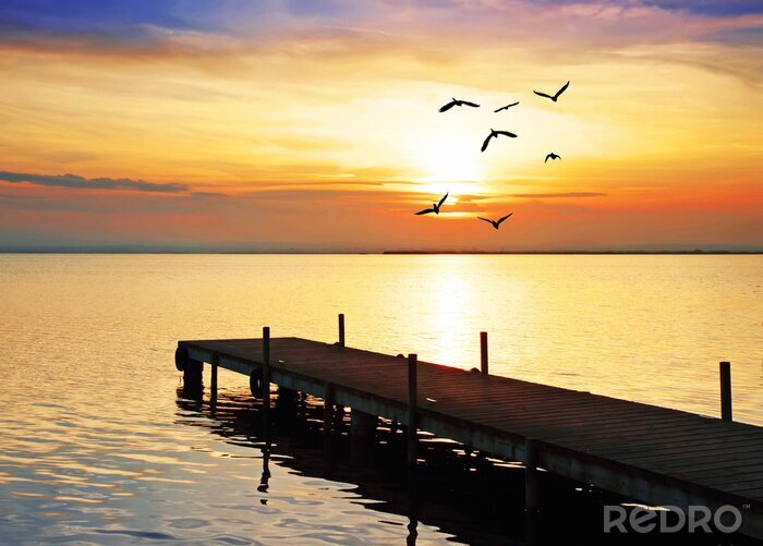 Sticker De zon boven de zee