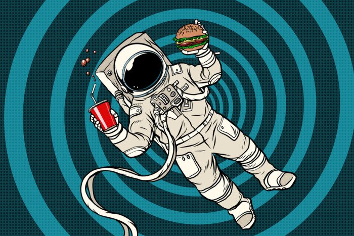 Sticker Een astronaut in een ruimtepak die een hamburger eet