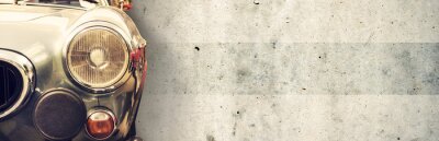 Sticker Fragment van een oude auto op de achtergrond van de muur