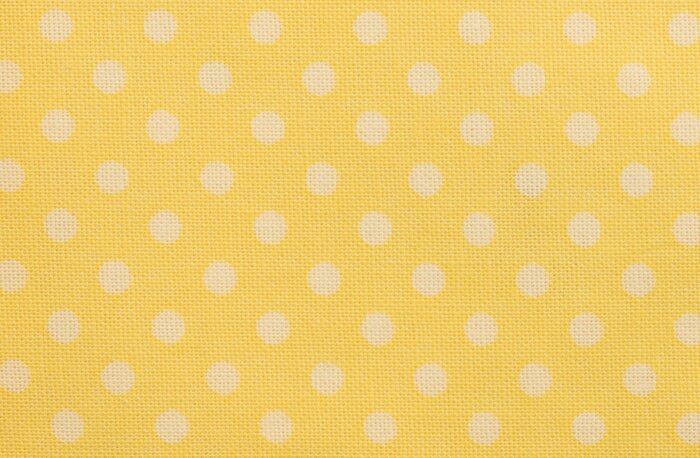 Sticker Geel tafelkleed met witte stippen Macro