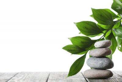 Sticker Gladde stenen gerangschikt op grijze planken