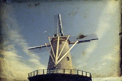 Nederlandse windmolen op een retro foto