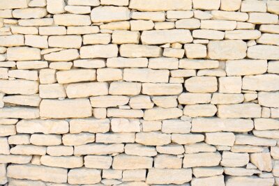 Onregelmatige beige stenen muur