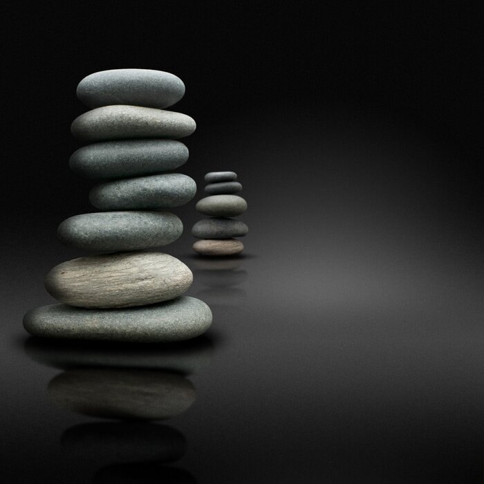 Sticker ontspanning sur fond noir, pierres empilées zen houding
