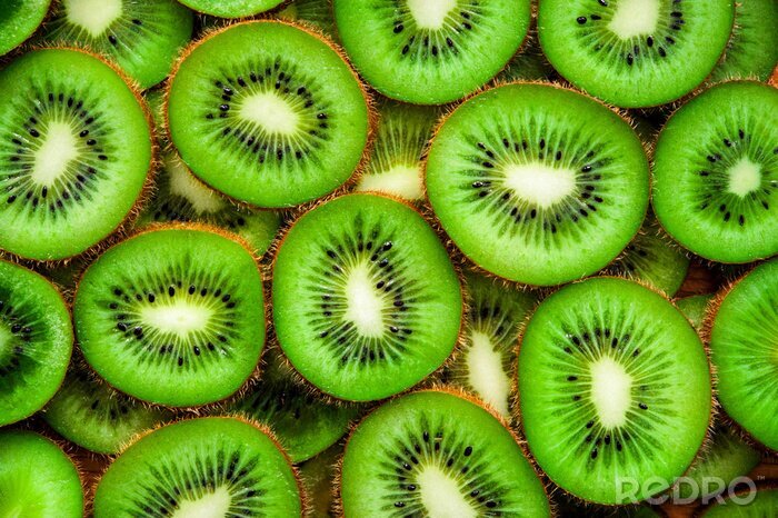 Sticker Sappige groene ronde stukjes kiwi op het oppervlak