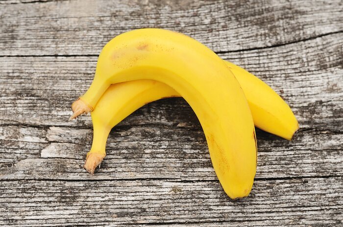 Sticker Twee bananen op grijze planken