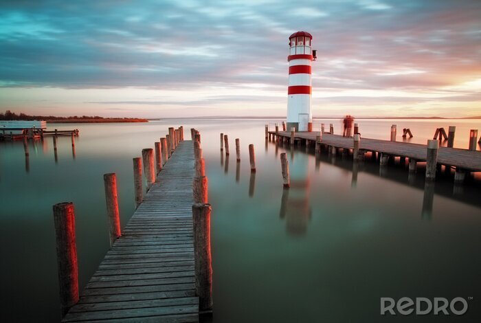 Sticker Vuurtoren en zee in de avond