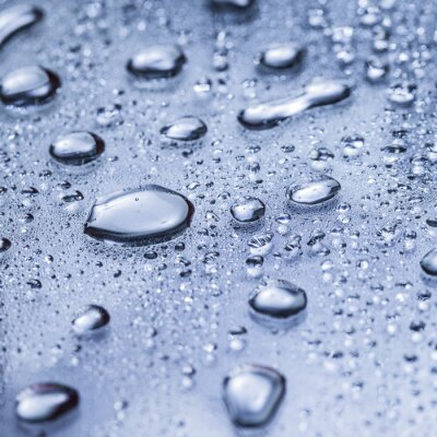 Sticker Water druppels op een blauwe oppervlak
